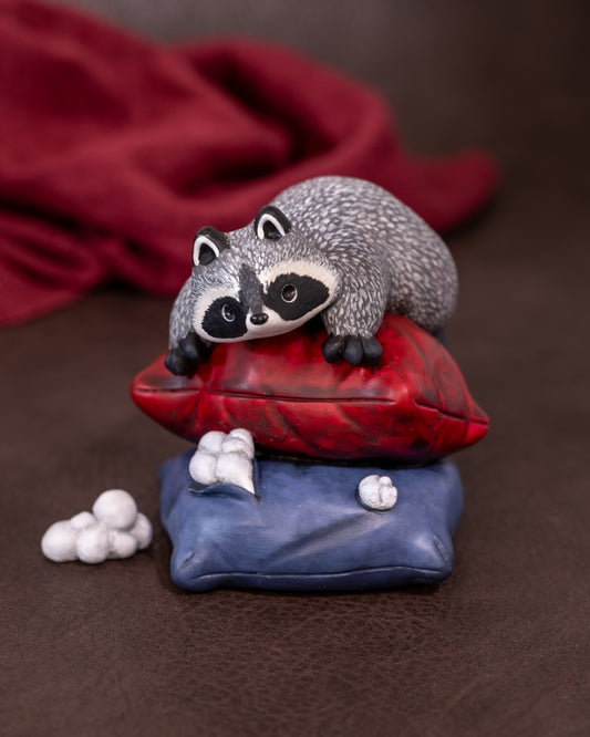 Raccoon with Pillows Figurine in Polymer Clay